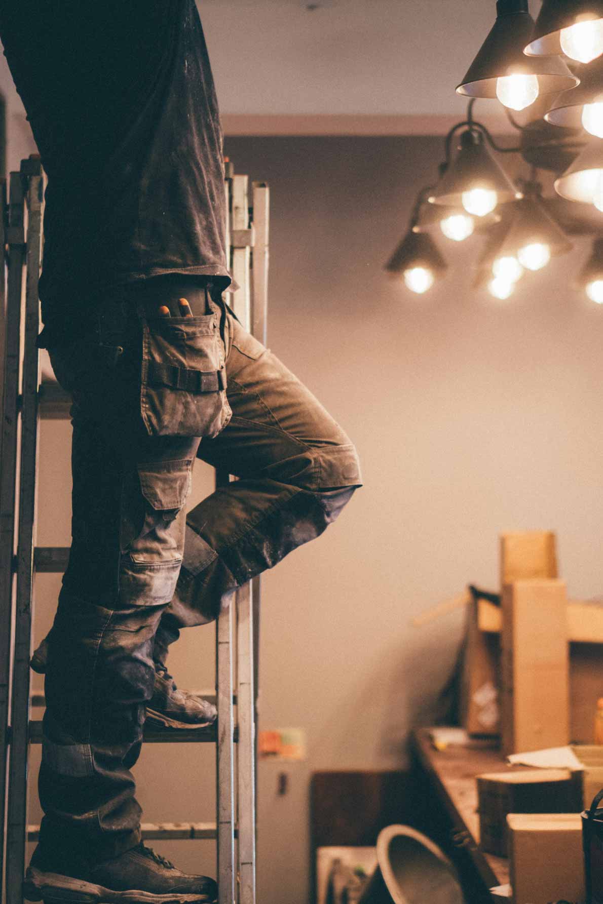 James McGuffey working at an electrical panel on a Coweta County job site